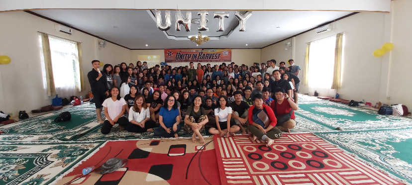 Group photo taking in meeting room with carpet