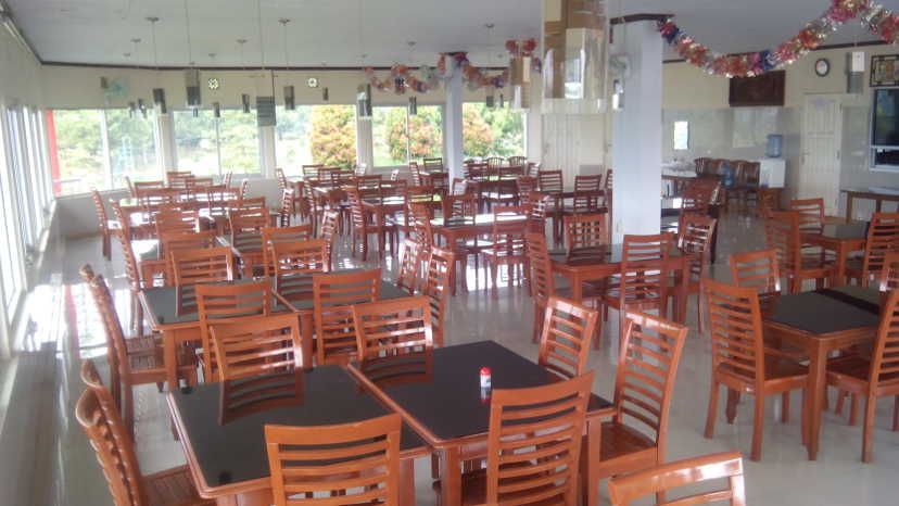 Wooden tables and chairs in dining room