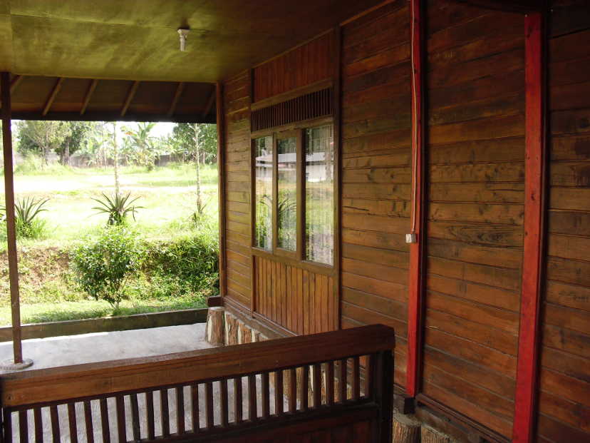 Veranda of bedroom with glass window of a wooden house